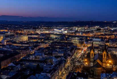 Render of The Vltava Philharmonic Hall lit up at dusk