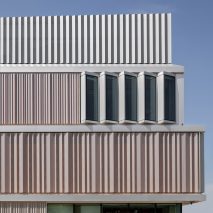 Folding aluminium covers the exterior of the building