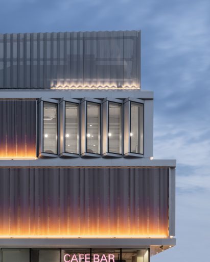 Image of the exterior of West Hub lit at dusk