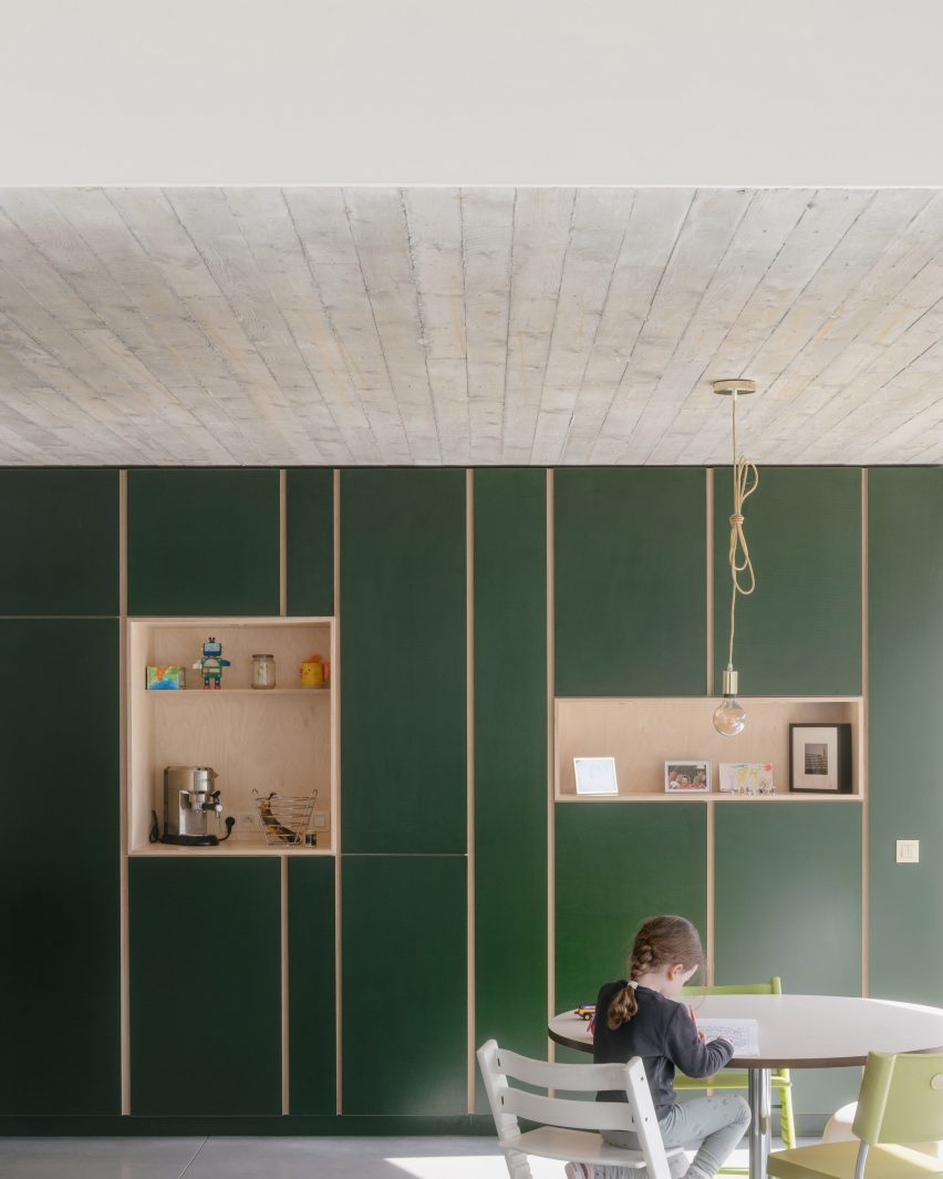 Kitchen with green cabinetry