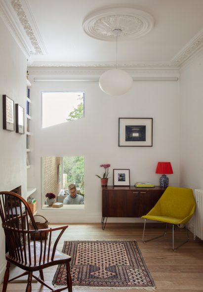 Interior image of a living area with geometric cutouts in the walls