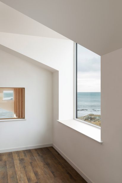 Interior image of the home which features white painted walls and wooden floors