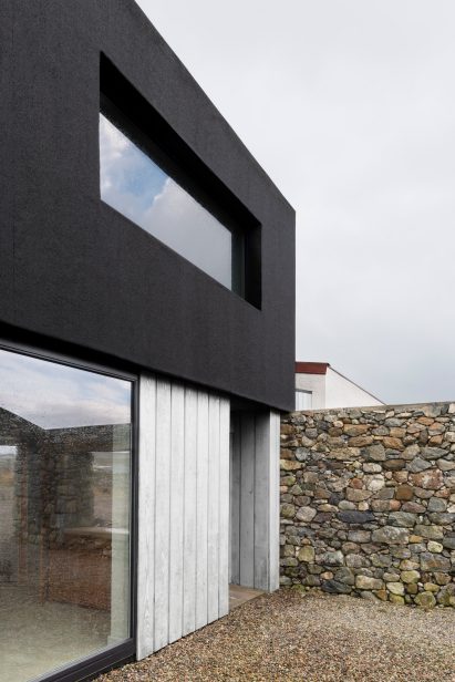 The home has a black and white exterior 