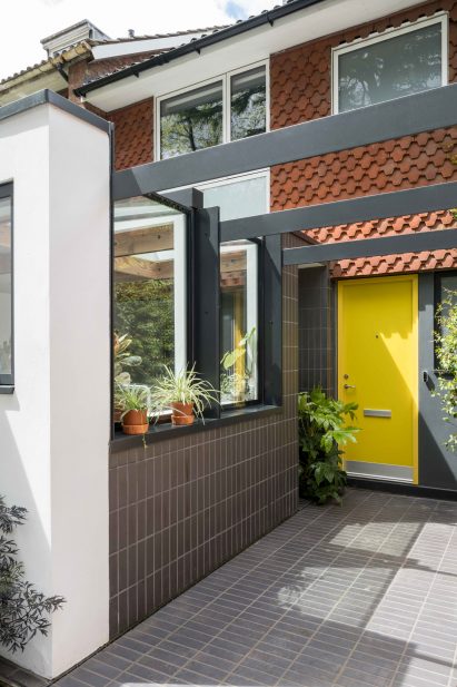 Image of the front of Little Brownings by Archmongers which has a yellow painted door