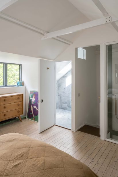 A bedroom has a marble lined en-suite