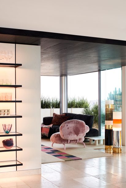 Fluffy pink armchair in living room Dream Weaver penthouse