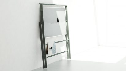 Easel OLED display folded and leant against a white wall
