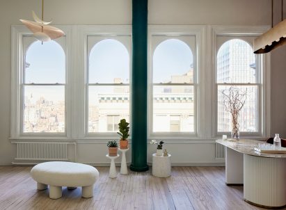 A reception area with four arched windows