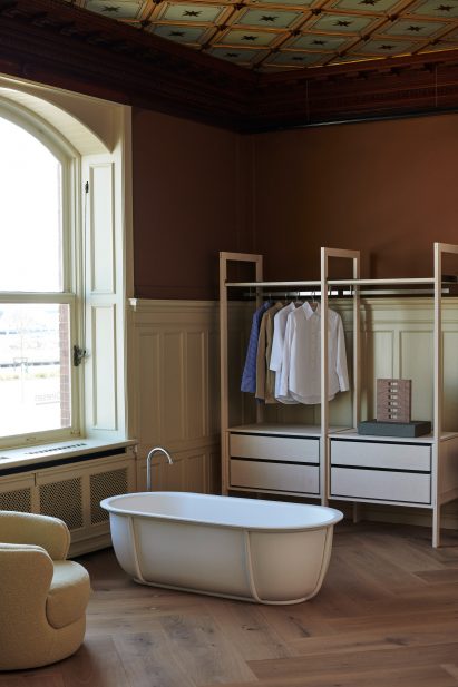 Freestanding bathtub in Aarhus furniture showroom by Bunn Studio