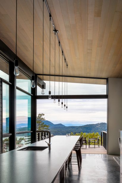 Interior image of the kitchen at Buck Mountain Cabin which looks out to the mountains