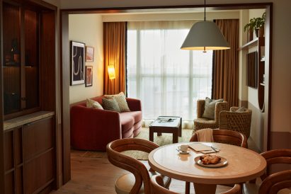 An open plan living room in a hotel guest suite