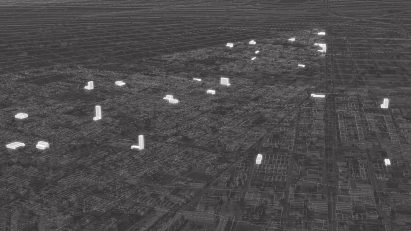 Dark grey axonometric city plan with highlighted white buildings by a student at Tulane University