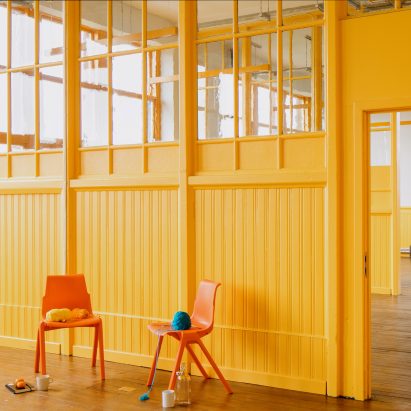 Yellow interior of Kinning Park Complex renovation by New Practice
