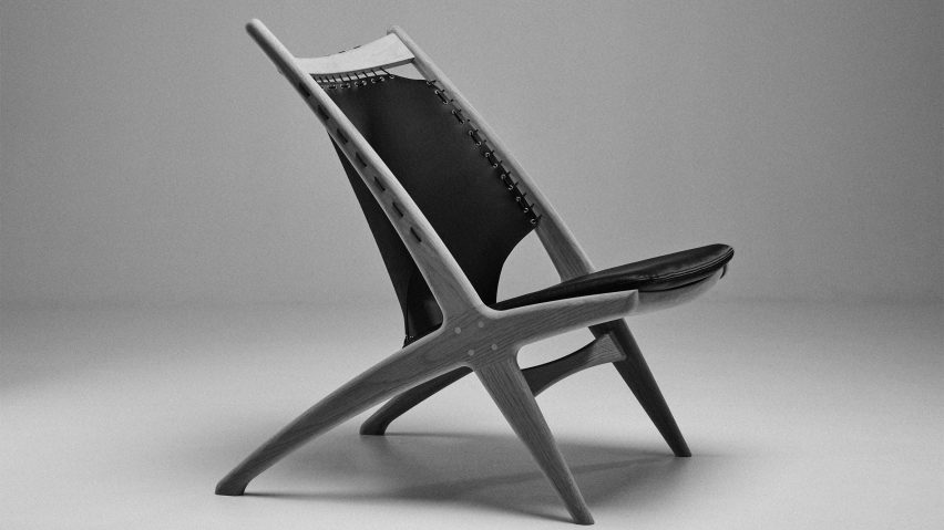 Krysset chair with grey frame and black backrest and seat