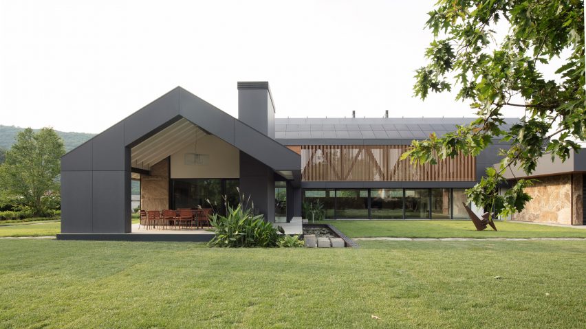 A building is pictured clad in grey Lapitec panelling