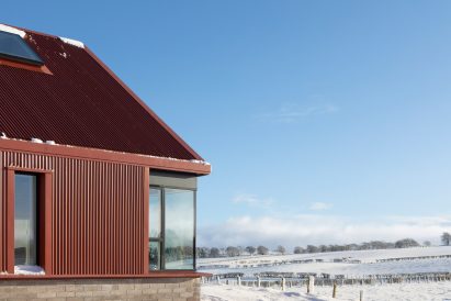 Image of the red aluminium clad exterior of Ceangal House