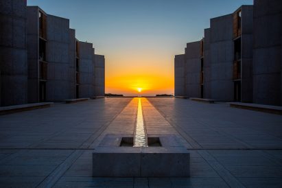 Image of the the sun lining up with the stream at the Salk Institute