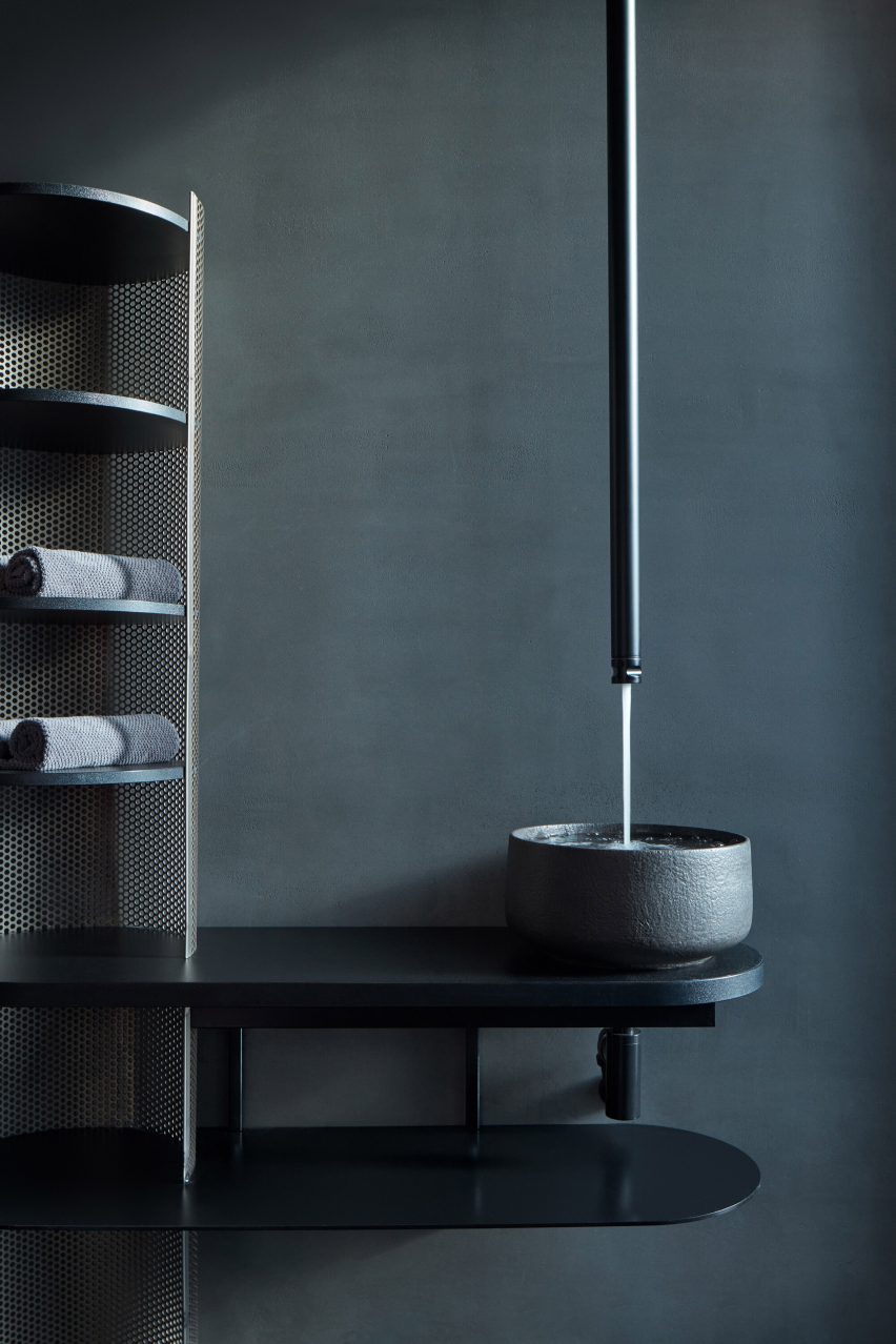Sink with ceiling-mounted tap running vertically into the bowl below