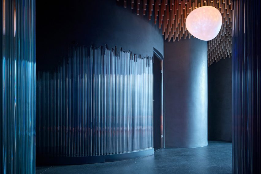 Blue and grey illuminated glass bars in spa area