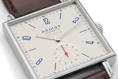 Close-up of watch face on off-white Tetra Neomatik 39