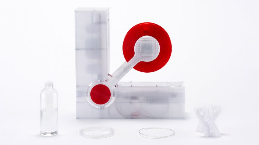 Polyformer recycling machine by Reiten Cheng next to a plastic bottle