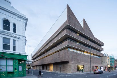 Brick building with sawtooth roof by Herzog & de Meuron