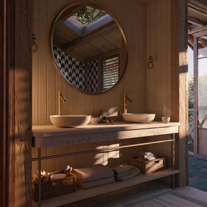 Large round mirror hangs above a travertine and wood washbasin with Axor taps
