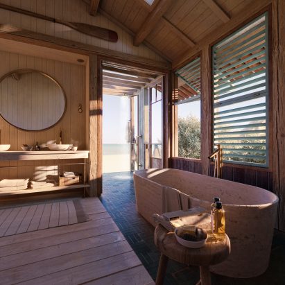 Coastal bathroom with wood panelling bySarah Poniatowski 
