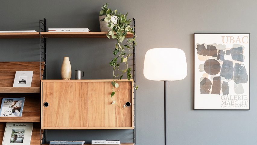 Soft floor lamp by Case Furniture next to a bookcase