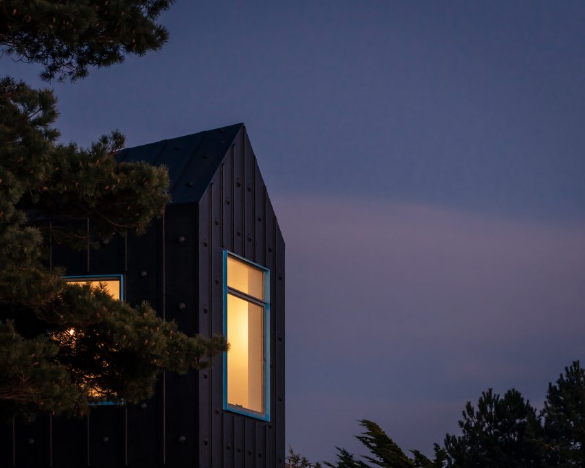 Night view of The Pottering Shed by Studio Mutt