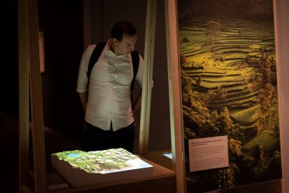 Paul Eastell of Buro Happold looking at model of Symbiocene installation at the Barbican