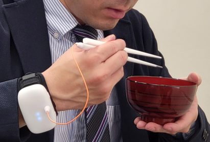 A man eating Miso with Taste-Adjusting Chopsticks