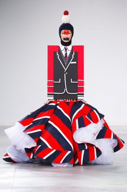 A model wears a jacket that was inspired by an etch-a-sketch at the Thom Browne Autumn Winter 2022 show