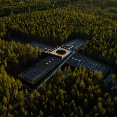 Birde-eye view of The Plus furniture factory by BIG for Vestre in a forest