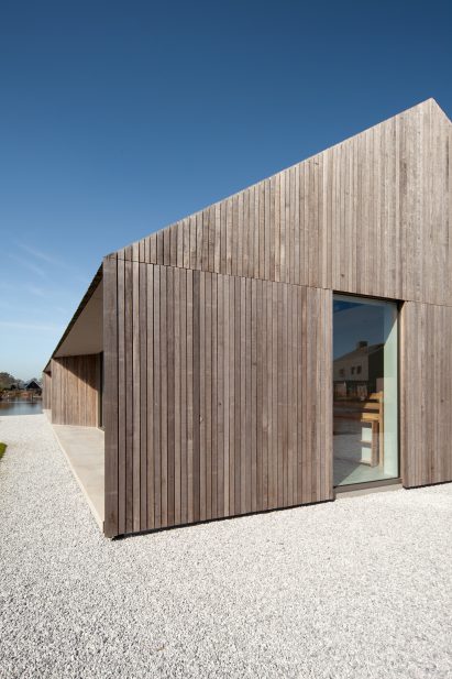 Rectangular windows punctuate the facade of Villa K2