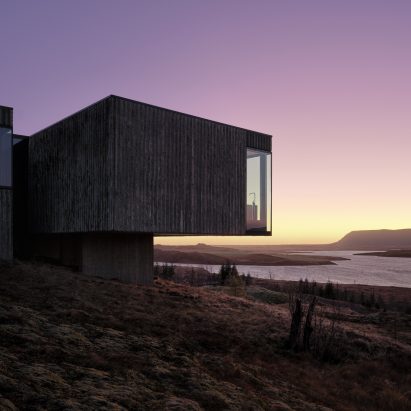 A photograph of Arborg House at night by PK Arkitektar