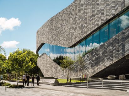 Facade clad in herringbone tiles