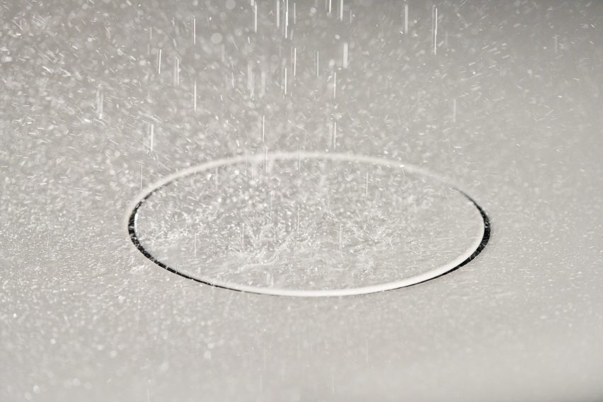 Closeup shot of shiny white bathroom surface with water droplets