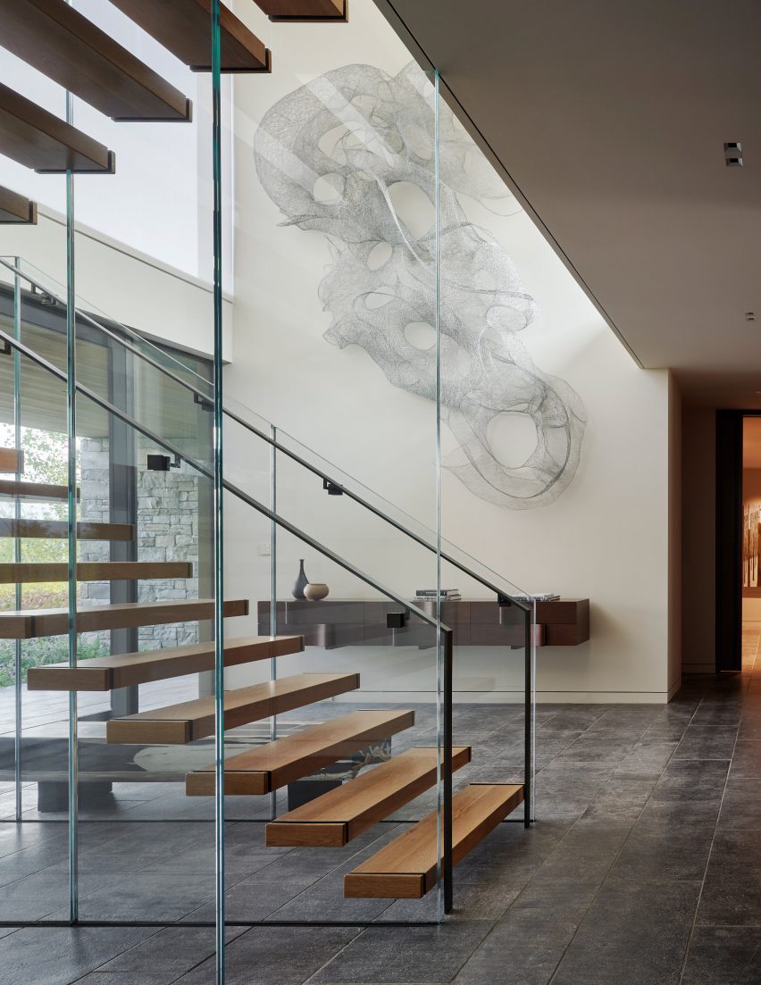 Four pines interior glass staircase