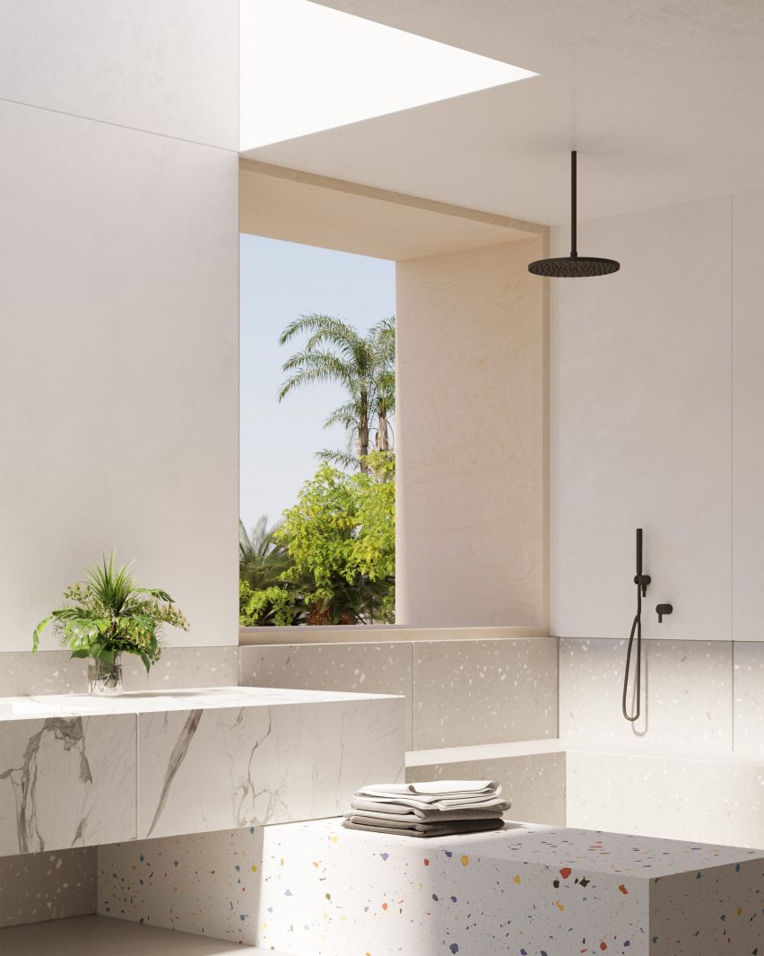Bathroom with marble and terrazzo finished on sink, shower and walls