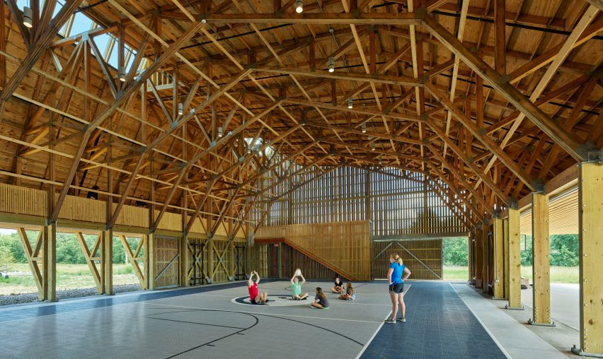 Kids playing in a barn-like building