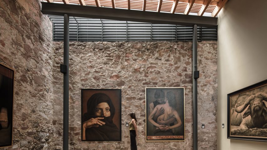 Carbonell Foundation gallery with stone wall and skylights