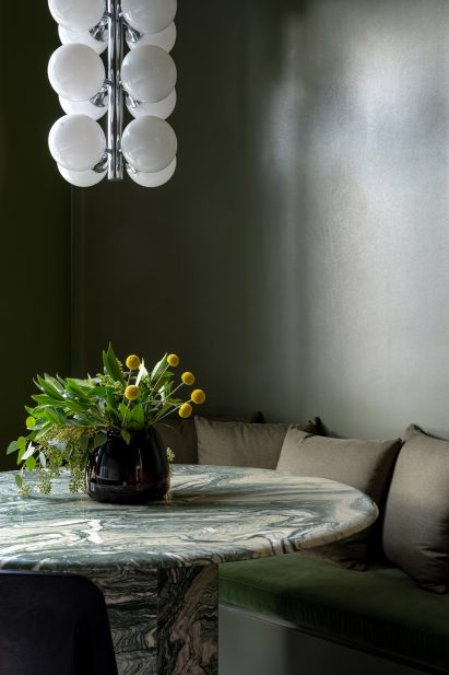 Hanging lights and dark green walls