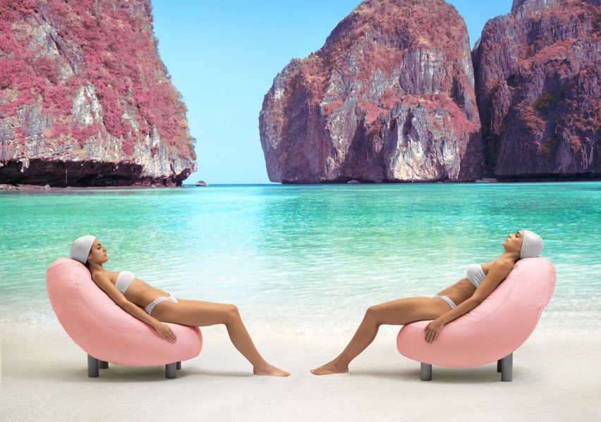 Pink seat with black legs in use on beach