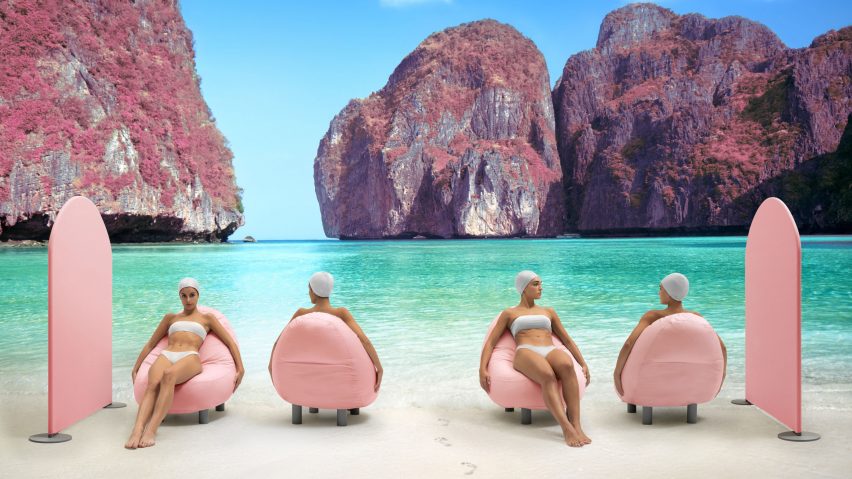 Pink seat with black legs in use on beach