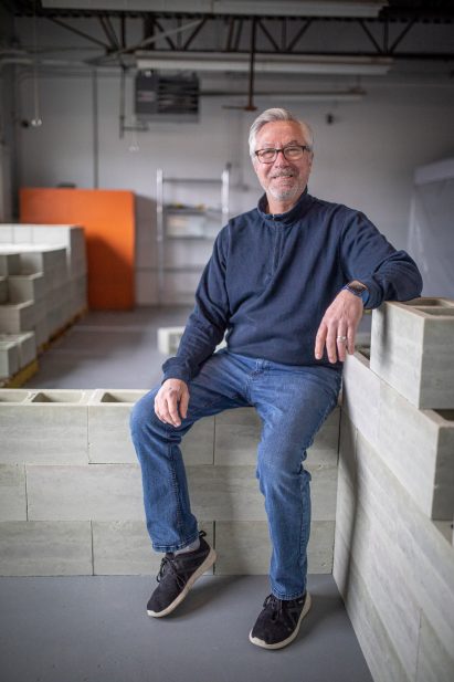Loren Burnett with biocomposite cinderblocks