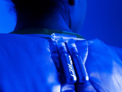 A photograph a technology strapped to someone's back and designed to measure stress level