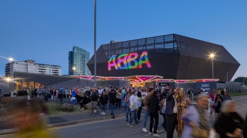 People are picture leaving the hexagonal-shaped performance venue