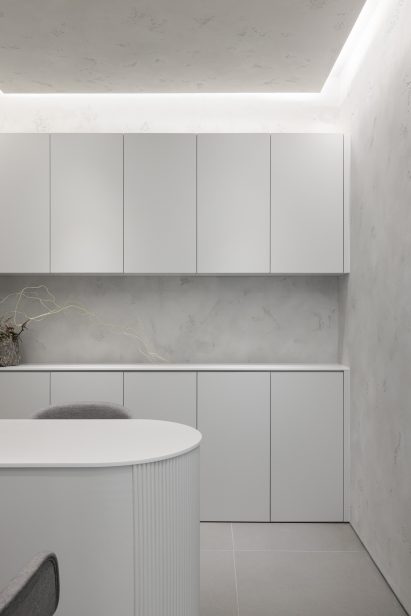 Interior of Vancouver skin clinic designed by Leckie Studio with marble walls and white storage