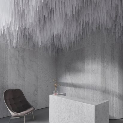 Reception of AER Skinlab in Vancouver by Leckie Studio with marble walls and stalactite-like ceiling installation